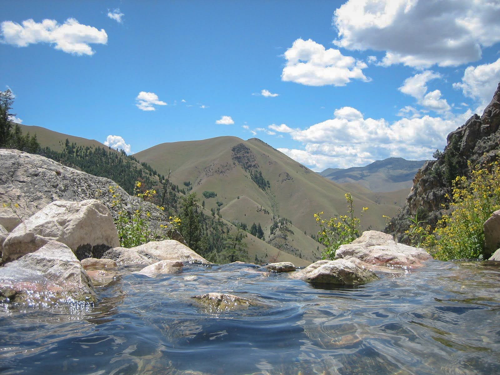 Nature scene with mountains and water.