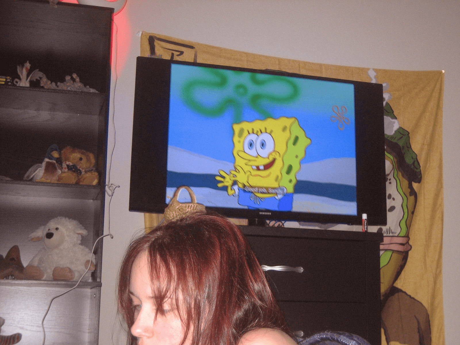 Girl watching Spongebob on TV.